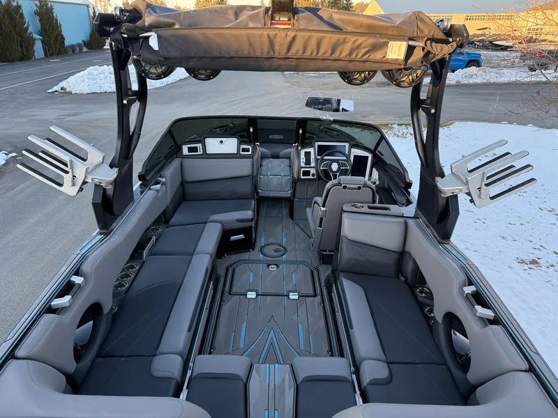 Slide: The Image of 2022 Supra SL boat interior with modern seating and advanced dashboard features. - 16