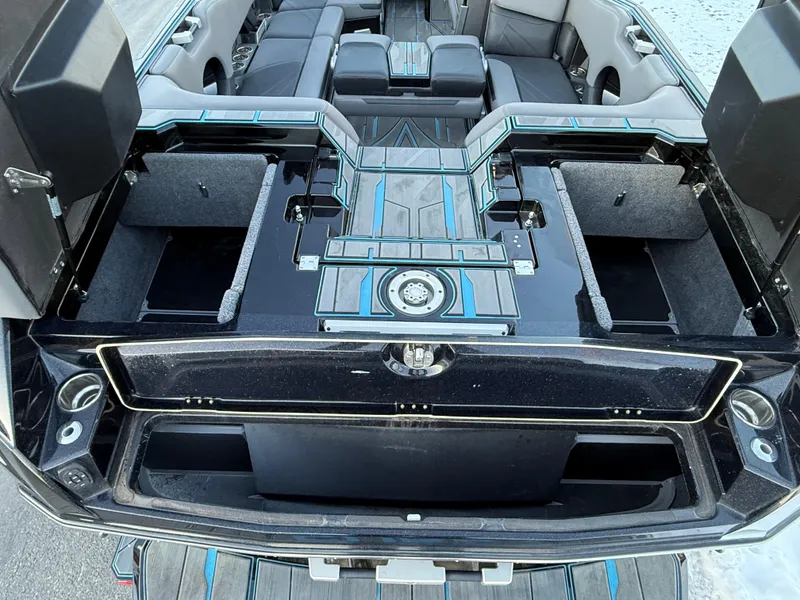 Slide: The Image of 2022 Supra SL boat interior with open storage compartments and seating area. - 23