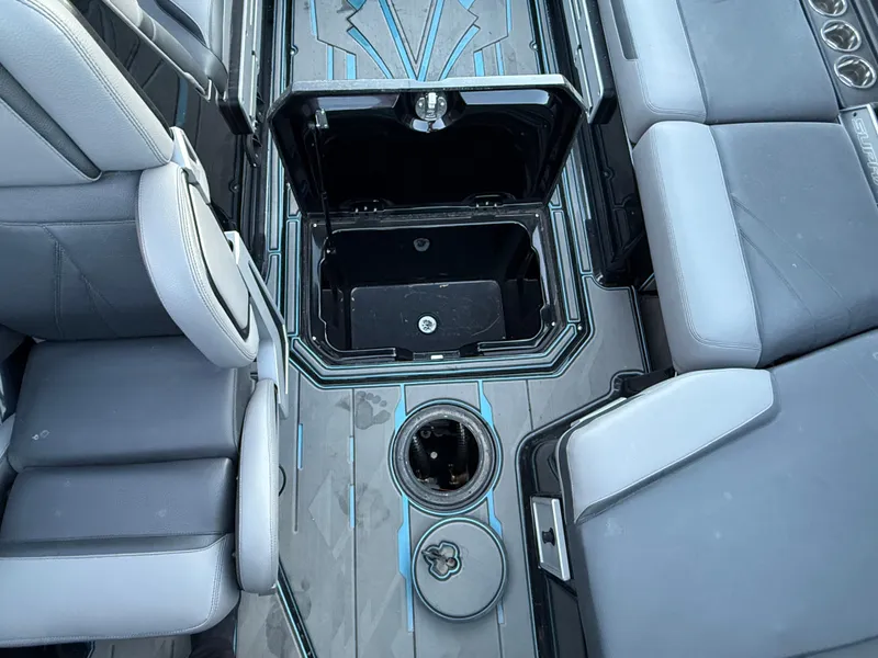 Slide: The Image of 2022 Supra SL boat interior with open storage compartment and seating. - 27