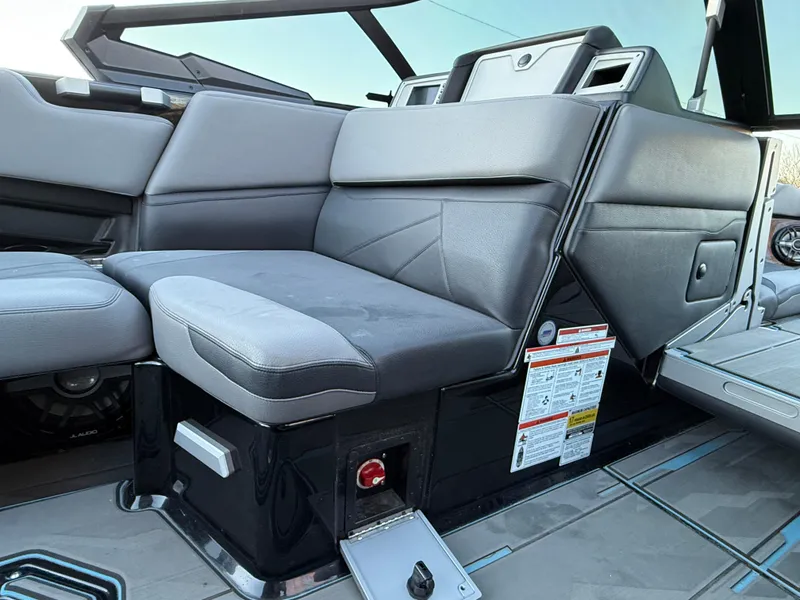 Slide: The Image of 2022 Supra SL boat interior with sleek gray seating and modern design. - 28