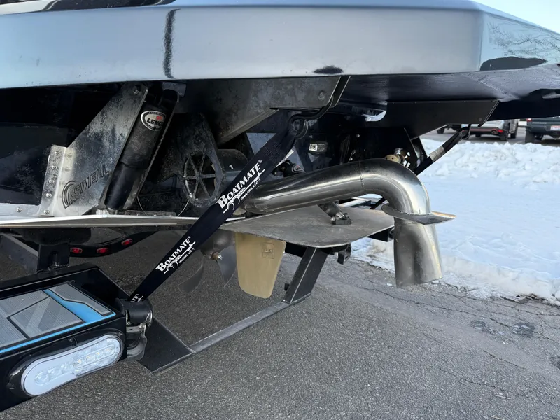 Slide: The Image of 2022 Supra SL boat exhaust and propeller detail on a snowy day. - 31