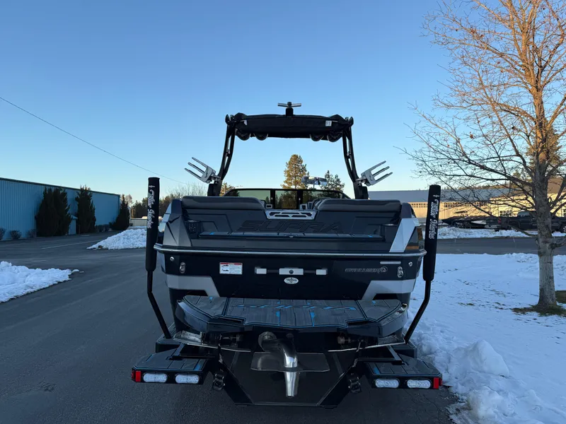 Slide: The Image of 2022 Supra SL boat rear view in snowy outdoor setting. - 32