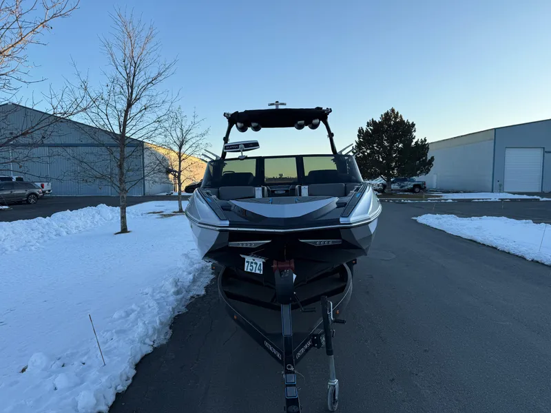 Slide: The Image of 2022 Supra SL boat on trailer in snowy parking lot. - 34