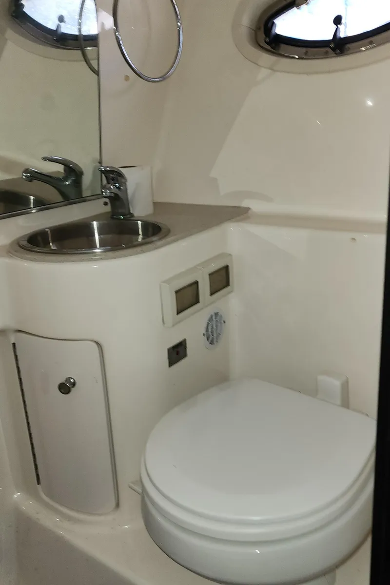 Slide: The Image of Compact bathroom in 2012 Tiara Yachts 3100 Coronet, featuring sink and toilet. - 31