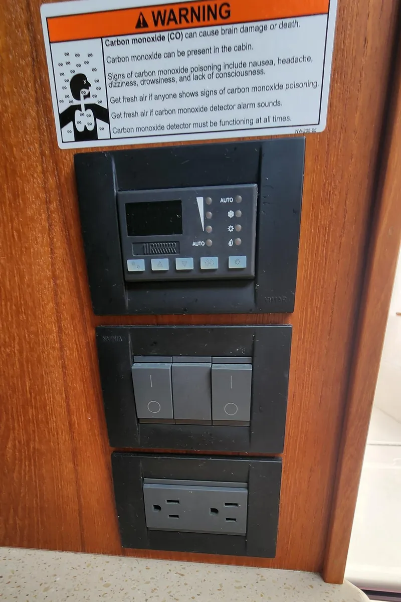 Slide: The Image of Control panel on 2012 Tiara Yachts 3100 Coronet with carbon monoxide warning sign. - 32