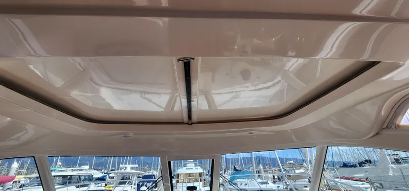 Slide: The Image of Ceiling view of 2012 Tiara Yachts 3100 Coronet with marina background. - 33