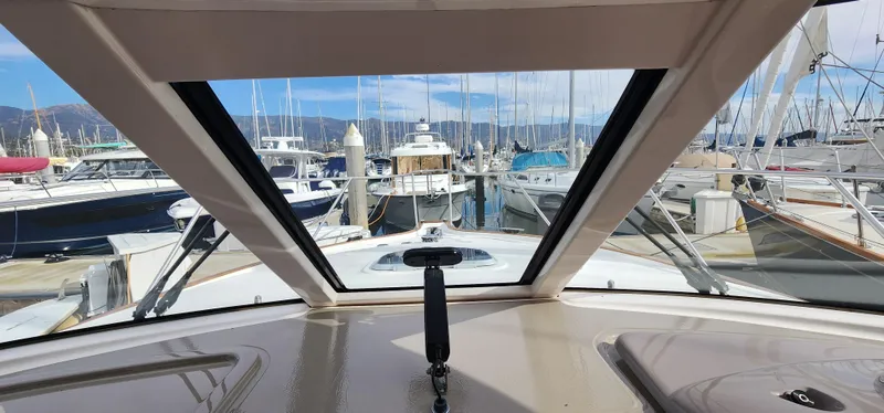 Slide: The Image of View from 2012 Tiara Yachts 3100 Coronet, overlooking marina with multiple boats docked. - 34