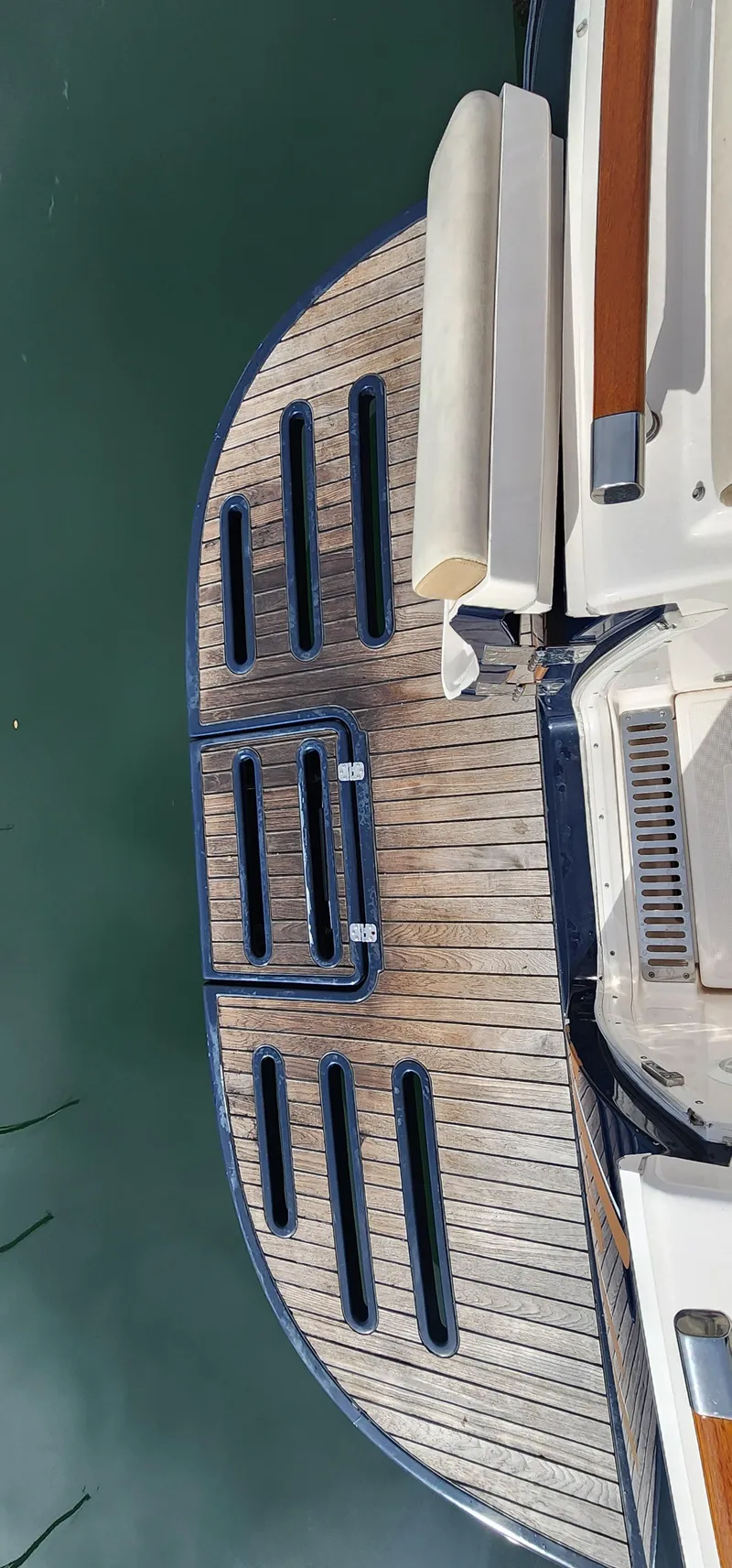 Slide: The Image of 2012 Tiara Yachts 3100 Coronet swim platform with wooden finish and ladder. - 38