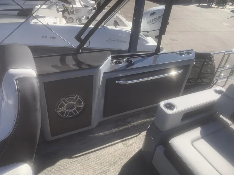 Slide: The Image of Interior view of a 2025 Godfrey San Pan 2700 DFLW boat, featuring sleek seating and modern design. - 12