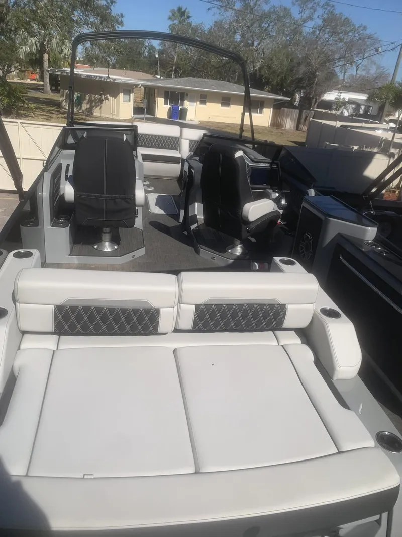 Slide: The Image of 2025 Godfrey San Pan 2700 DFLW boat interior with luxurious seating and modern design. - 8