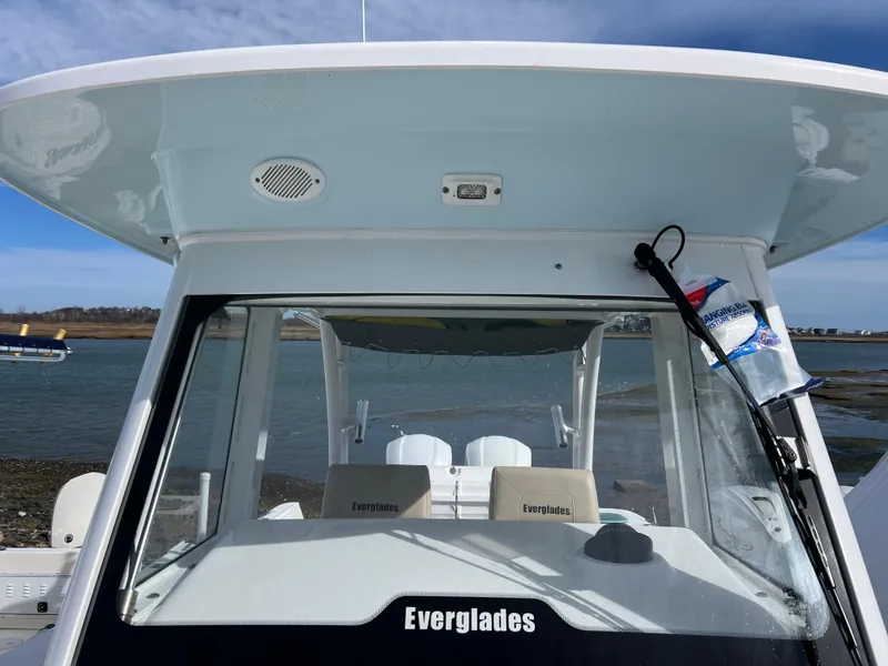 Slide: The Image of 2014 Everglades 325 Center Console boat with twin Yamaha engines on a calm waterway. - 6