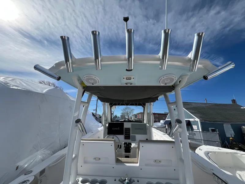Slide: The Image of 2014 Everglades 325 Center Console boat with twin Yamaha engines on calm water. - 7