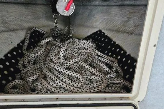 Slide: The Image of Coiled rope in anchor locker of 1993 Marlin Yachts Cuddy SF boat. - 15