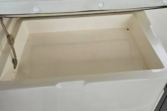 Slide: The Image of Open storage compartment on a 1993 Marlin Yachts Cuddy SF boat. - 18