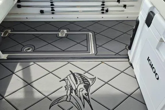 Slide: The Image of 1993 Marlin Yachts Cuddy SF deck with fishing rod holders and marlin design. - 20