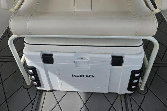 Slide: The Image of White Igloo cooler under seat on 1993 Marlin Yachts Cuddy SF boat. - 22