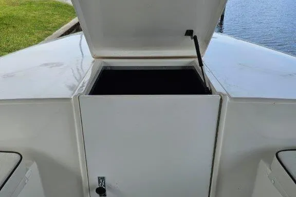 Slide: The Image of Open storage compartment on 1993 Marlin Yachts Cuddy SF boat deck. - 9