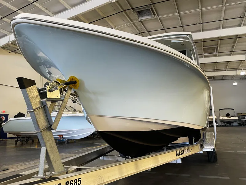 Slide: The Image of 2023 Key West 239 DFS boat on trailer in indoor showroom. - 10