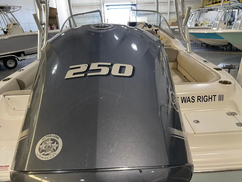 Slide: The Image of 2023 Key West 239 DFS boat with 250 horsepower engine in a showroom. - 14