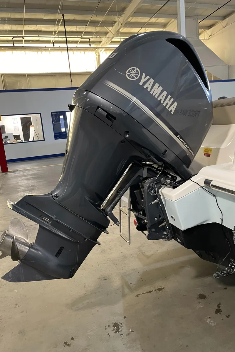 Slide: The Image of 2023 Key West 239 DFS with Yamaha outboard motor in a showroom. - 15