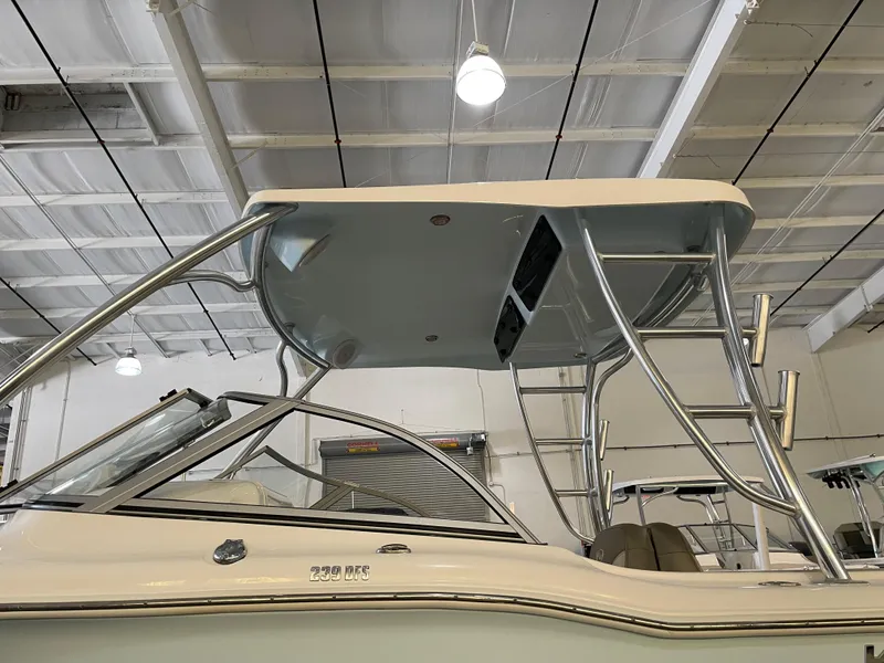 Slide: The Image of 2023 Key West 239 DFS boat with T-top in a showroom. - 17