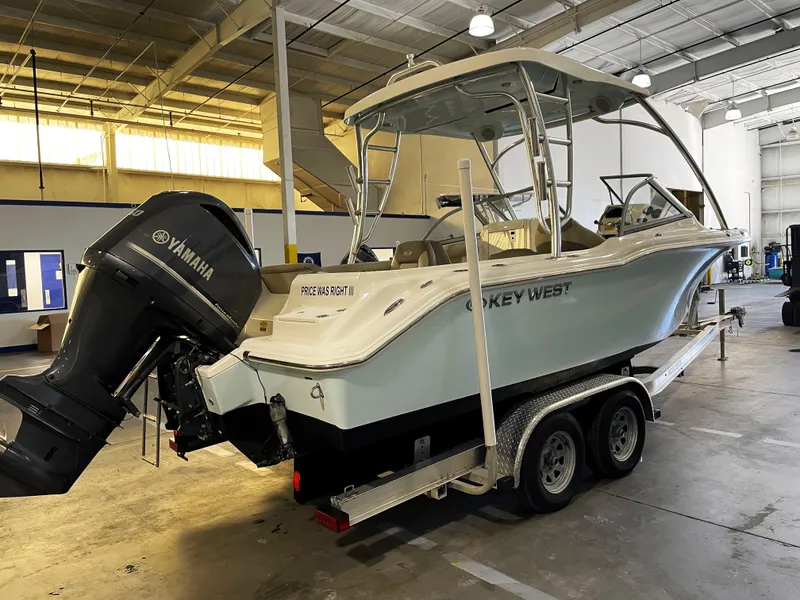 Slide: The Image of 2023 Key West 239 DFS boat on trailer in indoor storage facility. - 3