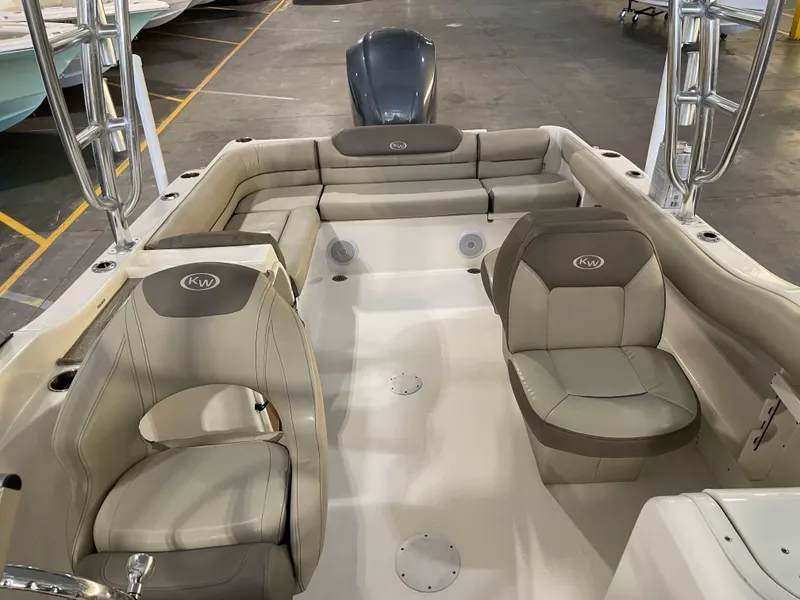 Slide: The Image of 2023 Key West 239 DFS boat interior with beige seating and modern design. - 30