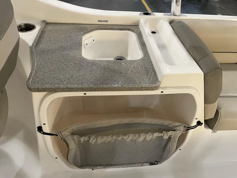 Slide: The Image of 2023 Key West 239 DFS boat interior with sink and storage compartment. - 33