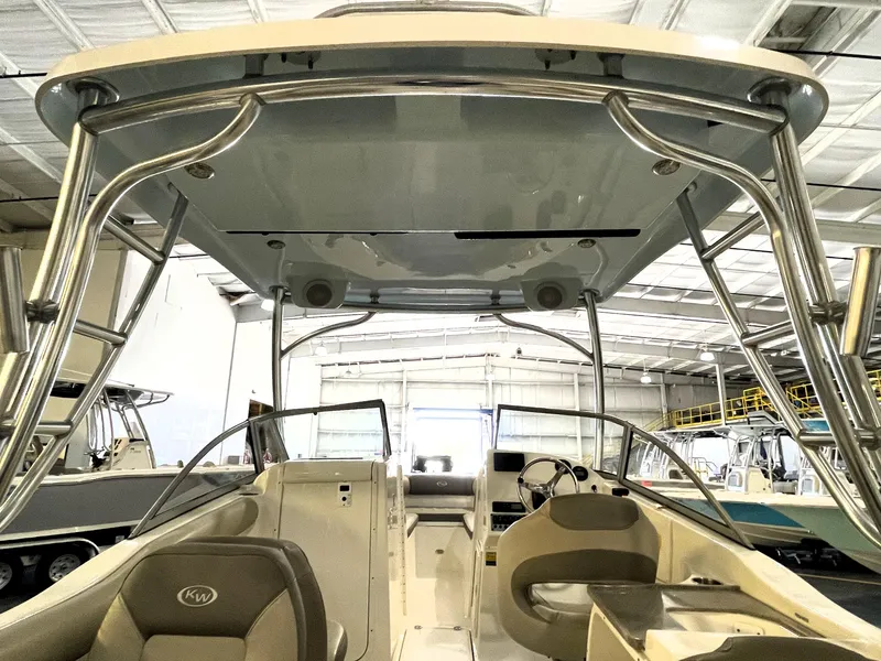 Slide: The Image of 2023 Key West 239 DFS boat interior with canopy in a showroom. - 36