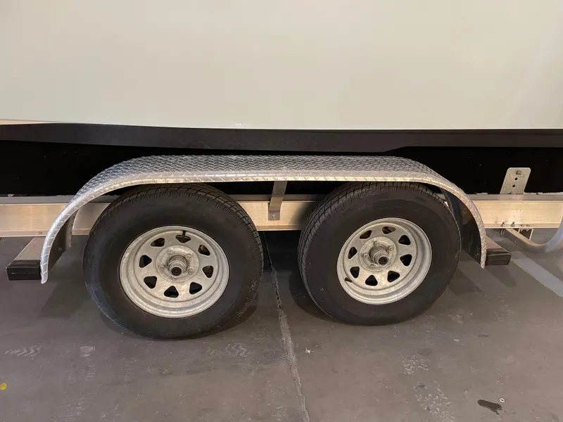 Slide: The Image of Trailer wheels of a 2023 Key West 239 DFS boat. - 39