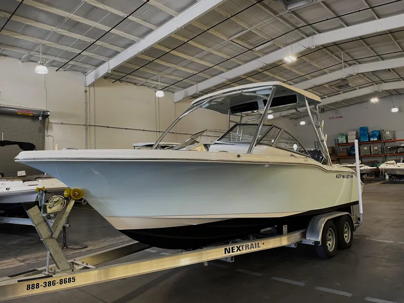 Slide: The Image of 2023 Key West 239 DFS boat on trailer in indoor storage facility. - 4