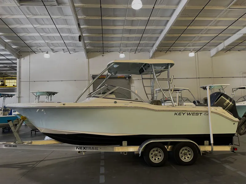 Slide: The Image of 2023 Key West 239 DFS boat on trailer in indoor storage facility. - 5