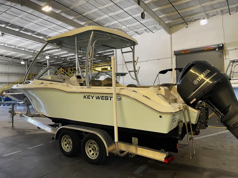 Slide: The Image of 2023 Key West 239 DFS boat in indoor showroom, front view. - 6