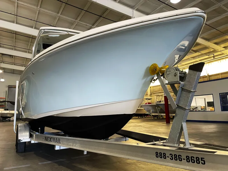 Slide: The Image of 2023 Key West 239 DFS boat on trailer in indoor showroom. - 9
