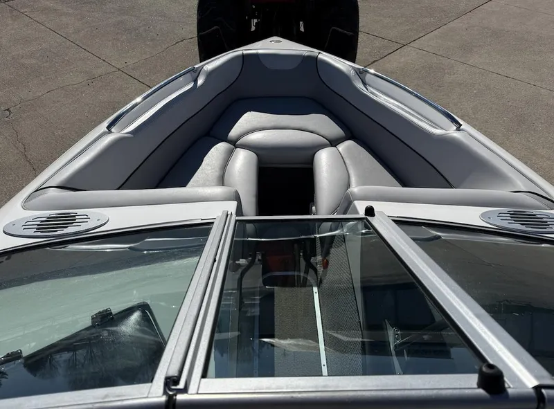 Slide: The Image of 2007 Centurion T5 boat interior with gray seating and glass windshield. - 11