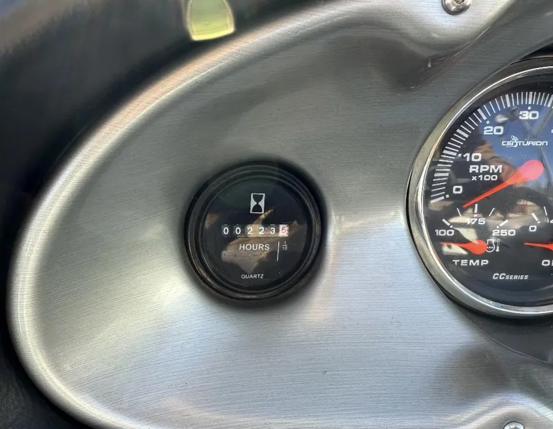 Slide: The Image of Dashboard of a 2007 Centurion T5 showing hour meter and RPM gauge. - 15