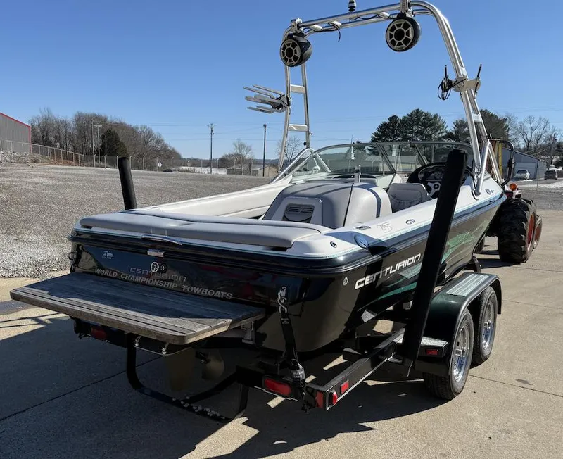 Slide: The Image of 2007 Centurion T5 boat on trailer, featuring wakeboard tower and speakers. - 6