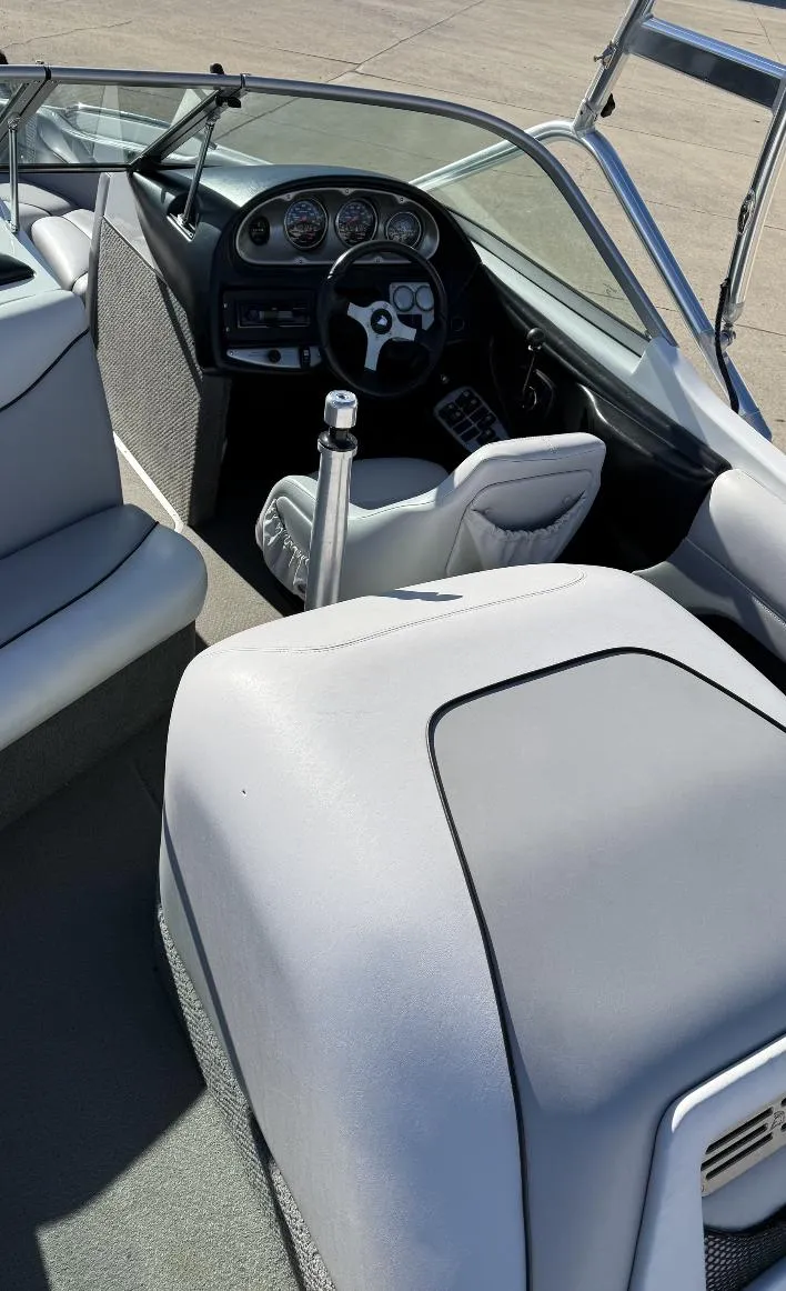 Slide: The Image of 2007 Centurion T5 boat interior with steering wheel and seating. - 8