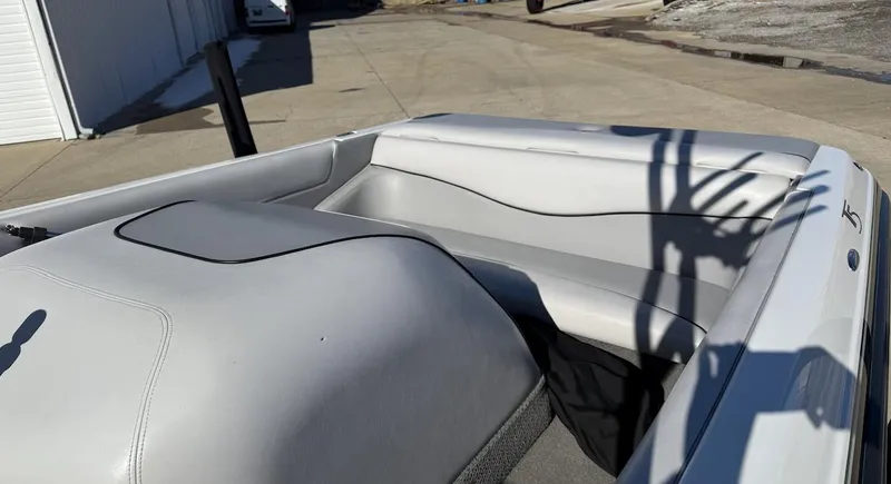 Slide: The Image of 2007 Centurion T5 boat interior with gray seating and shadow on a sunny day. - 9