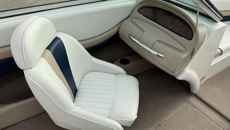 Slide: The Image of 2001 Caravelle 209 Bow Rider interior with white and blue seating. - 15