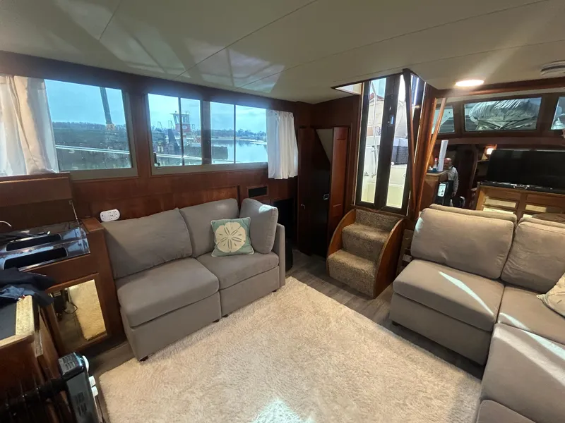 Slide: The Image of Interior of 1985 Viking 50 Cockpit MY yacht with cozy seating and large windows. - 10