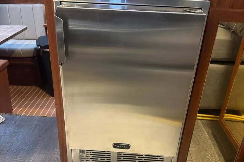 Slide: The Image of Stainless steel refrigerator inside 1985 Viking 50 Cockpit MY yacht interior. - 12