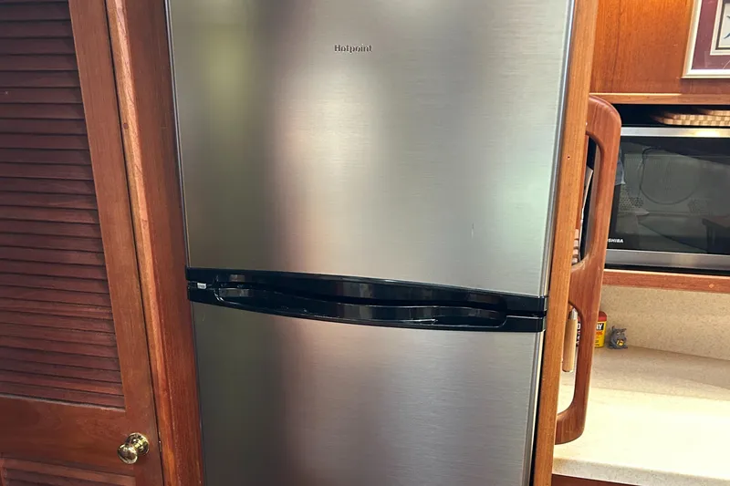 Slide: The Image of Stainless steel refrigerator in 1985 Viking 50 Cockpit MY yacht kitchen. - 18