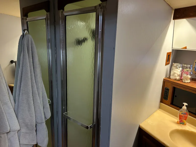 Slide: The Image of Bathroom interior of 1985 Viking 50 Cockpit MY with shower and sink area. - 23