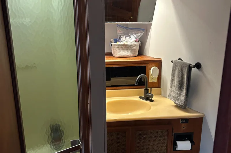 Slide: The Image of Bathroom interior of 1985 Viking 50 Cockpit MY yacht with sink and towel. - 24