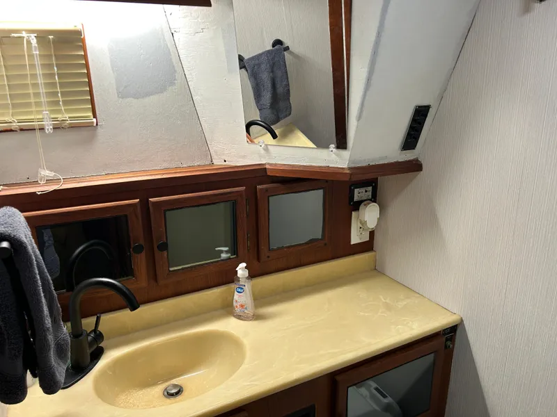 Slide: The Image of Bathroom interior of 1985 Viking 50 Cockpit MY yacht with sink and mirror. - 27