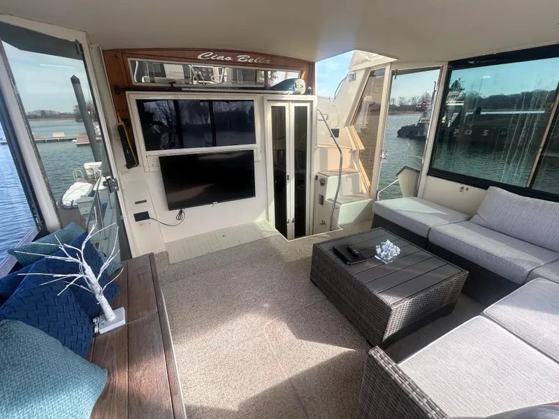 Slide: The Image of Interior of 1985 Viking 50 Cockpit MY yacht with modern seating and waterfront view. - 3