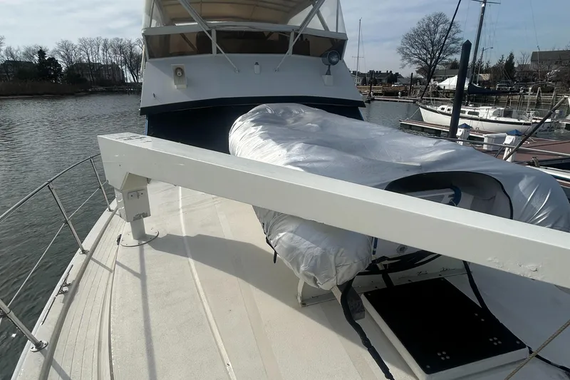 Slide: The Image of 1985 Viking 50 Cockpit MY yacht with covered equipment on deck, docked in a marina. - 31