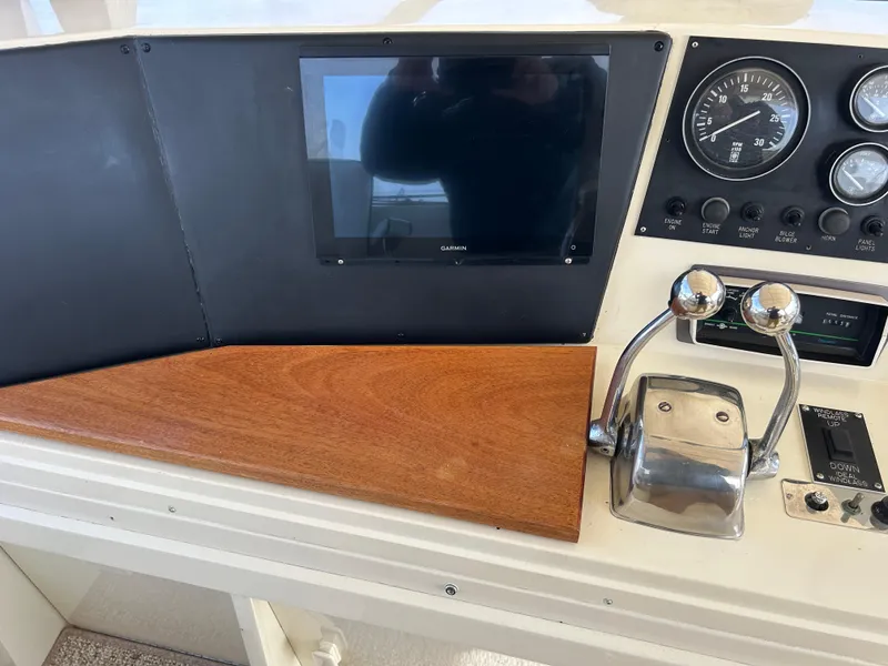 Slide: The Image of Control panel of 1985 Viking 50 Cockpit MY with gauges and throttle levers. - 37