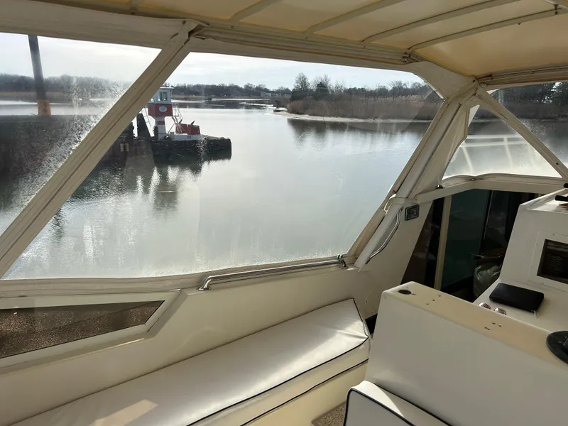Slide: The Image of Interior view of 1985 Viking 50 Cockpit MY yacht overlooking calm waters. - 39